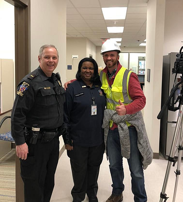 Spec Training Video's Tom Friedman standing with Bethesda Police Station staff.